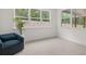 Relaxing sitting area with large windows and natural light at 51 Airmont Dr, Sharpsburg, GA 30277