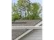 House roof with grey shingles and trees at 51 Airmont Dr, Sharpsburg, GA 30277