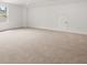 Bright, spacious bonus room with neutral decor at 51 Airmont Dr, Sharpsburg, GA 30277