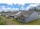 Community view showcasing multiple homes with patios at 51 Airmont Dr, Sharpsburg, GA 30277