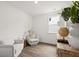 Bright sitting room with comfy seating and natural light at 51 Airmont Dr, Sharpsburg, GA 30277