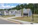 Gray-blue house with white accents and a two-car garage at 51 Airmont Dr, Sharpsburg, GA 30277