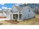 Craftsman style home with gray siding and stone accents at 51 Airmont Dr, Sharpsburg, GA 30277