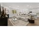Open concept living space, featuring a kitchen and living area at 51 Airmont Dr, Sharpsburg, GA 30277