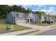 House exterior showcasing gray-blue siding and landscaping at 51 Airmont Dr, Sharpsburg, GA 30277