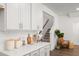Kitchen counter space with staircase view at 51 Airmont Dr, Sharpsburg, GA 30277