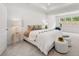 Main bedroom with large bed and window seat at 51 Airmont Dr, Sharpsburg, GA 30277