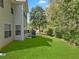 Private backyard with lush lawn, offering a tranquil outdoor space at 1240 Carriage Trace Cir, Stone Mountain, GA 30087