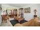 Living room with cozy furniture and view to dining area at 1240 Carriage Trace Cir, Stone Mountain, GA 30087