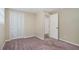 Bedroom with closet, carpet, and access to another room at 3881 Nations Dr, Douglasville, GA 30135