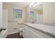 Bathroom boasts granite countertop, white cabinets, and vinyl flooring at 3881 Nations Dr, Douglasville, GA 30135