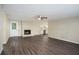 Spacious living room with fireplace, vinyl flooring and kitchen view at 3881 Nations Dr, Douglasville, GA 30135