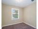 Well-lit bedroom featuring carpet and a window with blinds at 3881 Nations Dr, Douglasville, GA 30135