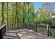 Wooden deck overlooking a wooded backyard at 3881 Nations Dr, Douglasville, GA 30135