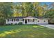 A charming ranch-style house with a well-maintained lawn at 3881 Nations Dr, Douglasville, GA 30135