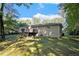 Brick house with a wooden deck and a large backyard at 3881 Nations Dr, Douglasville, GA 30135