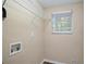 Laundry room with shelving, window, and hookups for washer/dryer at 3881 Nations Dr, Douglasville, GA 30135
