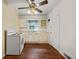 Bright kitchen features white cabinets, wood floors and an electric stove at 2490 Cascade Sw Rd, Atlanta, GA 30311