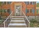 Front entrance with brick stairs and ornate railing leading to the front door at 2490 Cascade Sw Rd, Atlanta, GA 30311