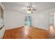 Spacious living room with hardwood floors and a light blue door at 2490 Cascade Sw Rd, Atlanta, GA 30311