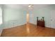Spacious bedroom with hardwood floors, green walls, and built-in storage at 2490 Cascade Sw Rd, Atlanta, GA 30311