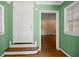 Interior view showing a hallway with green walls, hardwood floors and a door at 2490 Cascade Sw Rd, Atlanta, GA 30311