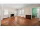 Spacious living room with hardwood floors, fireplace, and access to the backyard at 2490 Cascade Sw Rd, Atlanta, GA 30311