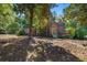 Brick house with blue shutters, landscaped yard, and spacious front porch at 2490 Cascade Sw Rd, Atlanta, GA 30311
