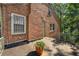 Brick home with a private deck and leafy green backdrop at 2490 Cascade Sw Rd, Atlanta, GA 30311