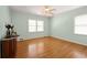 Light-filled bedroom featuring hardwood floors and soft green walls at 2490 Cascade Sw Rd, Atlanta, GA 30311