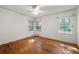Bedroom with hardwood floors, neutral walls and two windows at 2490 Cascade Sw Rd, Atlanta, GA 30311