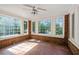 Sunroom with brick walls, tile floors and large windows at 2490 Cascade Sw Rd, Atlanta, GA 30311