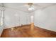 Spacious bedroom with hardwood floors and multiple doors at 2490 Cascade Sw Rd, Atlanta, GA 30311