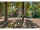Brick home's exterior, featuring landscaping and a walkway at 2490 Cascade Sw Rd, Atlanta, GA 30311