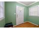 Bright entryway with green walls, hardwood floors, and a coat of paint at 2490 Cascade Sw Rd, Atlanta, GA 30311