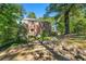 Rear view of brick home with carport and yard at 2490 Cascade Sw Rd, Atlanta, GA 30311