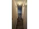 Long hallway with dark laminate wood flooring at 2190 Hunters Cove Dr, Lawrenceville, GA 30044