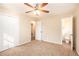 Spacious bedroom with ceiling fan, carpet, and en-suite bathroom at 2112 Royal Fox Way, Decatur, GA 30032