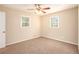 Bright bedroom with ceiling fan and neutral carpeting at 2112 Royal Fox Way, Decatur, GA 30032
