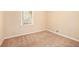 Small bedroom with neutral walls and carpet flooring at 2112 Royal Fox Way, Decatur, GA 30032
