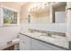 Updated bathroom with double vanity and granite countertops at 2112 Royal Fox Way, Decatur, GA 30032