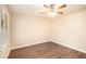 Spacious bedroom with wood-look flooring and ceiling fan at 2112 Royal Fox Way, Decatur, GA 30032