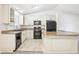Well-equipped kitchen featuring an island and white cabinets at 5035 Fairforest Dr, Stone Mountain, GA 30088