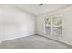 Simple bedroom with neutral walls and gray carpeting at 5035 Fairforest Dr, Stone Mountain, GA 30088
