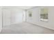 Bright bedroom with neutral walls and carpet at 5035 Fairforest Dr, Stone Mountain, GA 30088