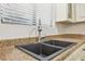 Double sink with modern faucet in a kitchen at 5035 Fairforest Dr, Stone Mountain, GA 30088