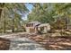 Two-story house with driveway and mature trees at 5035 Fairforest Dr, Stone Mountain, GA 30088