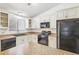 Updated kitchen with granite countertops and black appliances at 5035 Fairforest Dr, Stone Mountain, GA 30088
