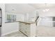 Bright kitchen features an island with drawers and granite countertops at 5035 Fairforest Dr, Stone Mountain, GA 30088