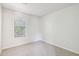 Simple bedroom with neutral walls, carpet, and window at 5035 Fairforest Dr, Stone Mountain, GA 30088